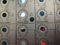 Apart from the two screws on the meters cover, there should be no need to remove any screws from the front panel,